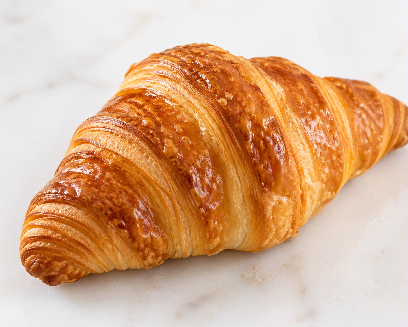 Freshly baked golden butter croissant